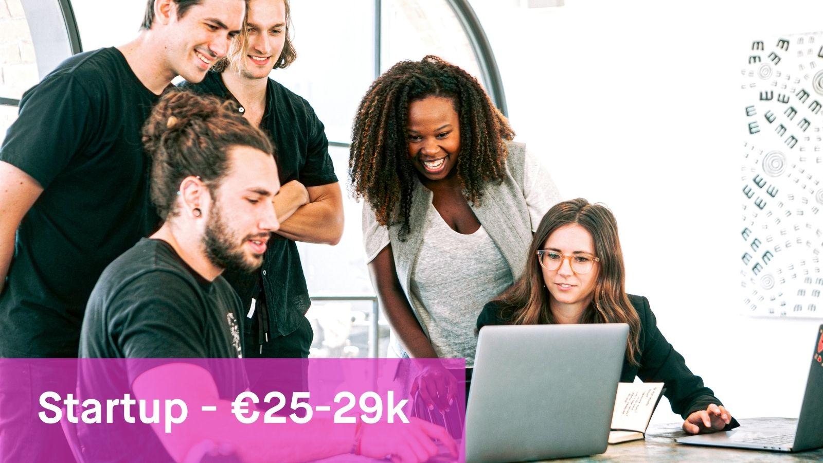 group of young people working with a computer